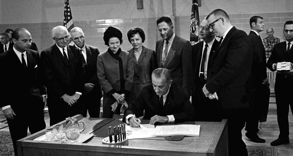 President Lyndon Johnson signing the Federal Elementary and Secondary Education Act of 1965
